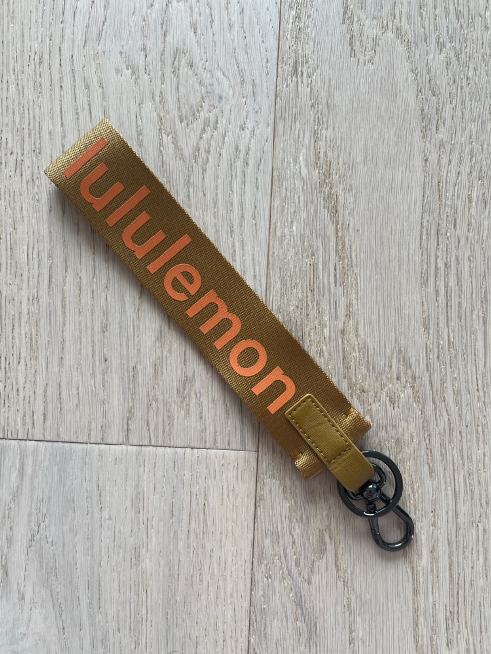 Lululemon “Never Lost” Key Chain with Orange Logo